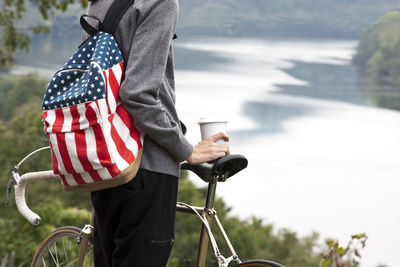 Rear view of man riding bicycle