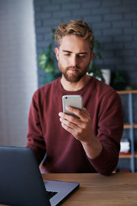 Young woman using mobile phone