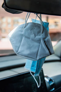 Close-up of clothes hanging on car window