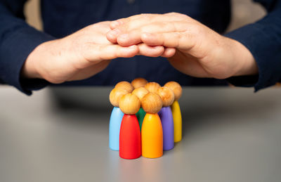 Midsection of man holding pills