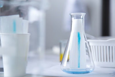 Close-up of glass bottle on table