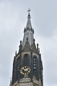 Low angle view of clock tower against sky