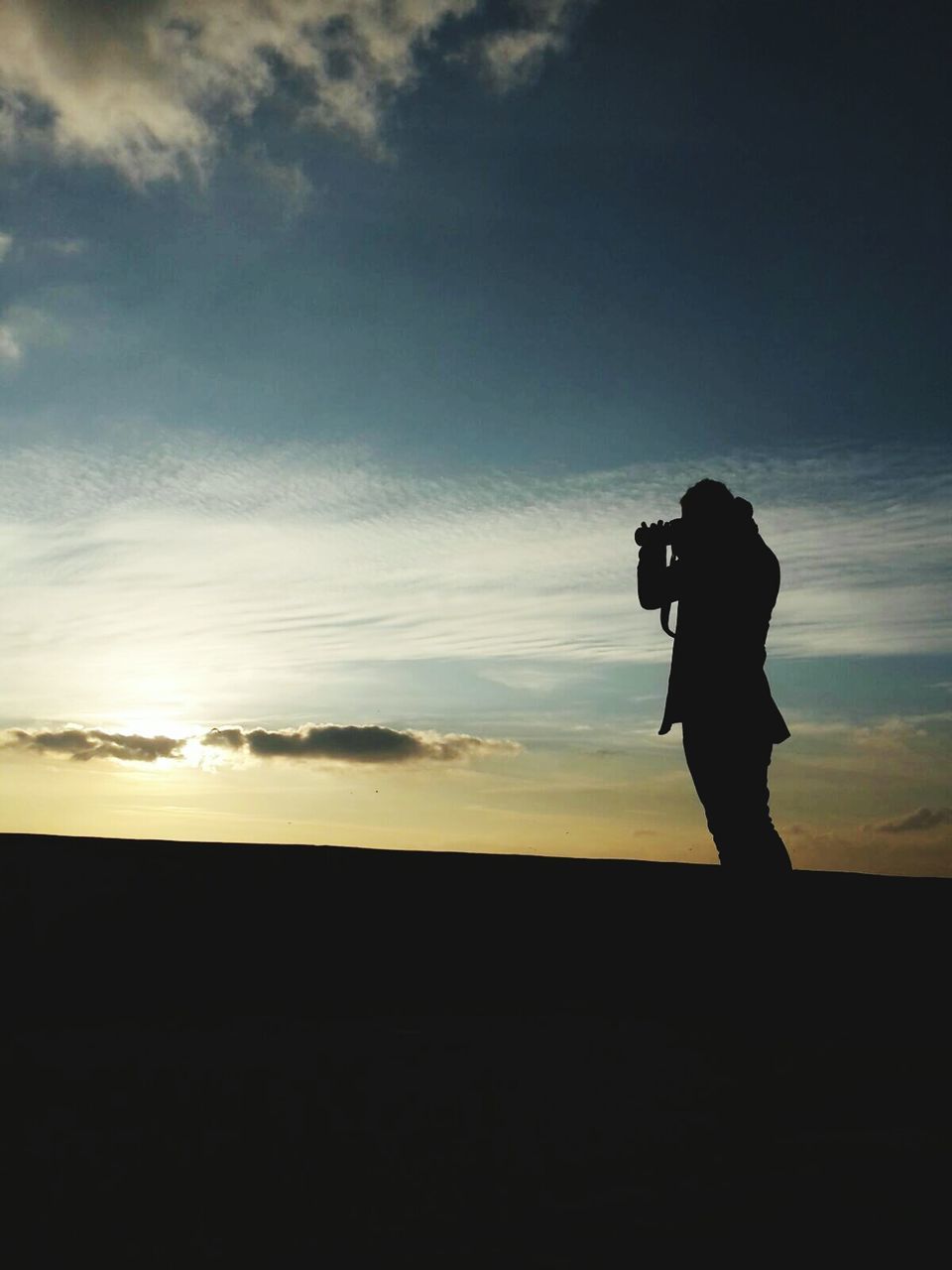 silhouette, sunset, sky, standing, lifestyles, leisure activity, men, tranquil scene, full length, scenics, tranquility, beauty in nature, cloud - sky, rear view, nature, outline, landscape, cloud