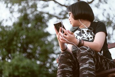 Woman holding mobile phone