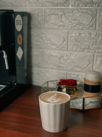 Close-up of coffee cup on table