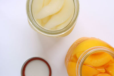 High angle view of drink in glass jar on white background