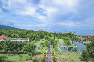 High angle view of trees and buildings against sky