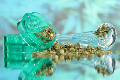 Close-up of cannabis on glass table