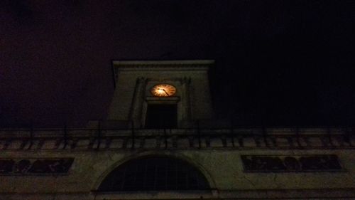 Low angle view of illuminated building at night