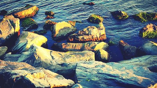 Full frame shot of rocks in sea