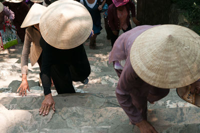 Rear view of people walking on street