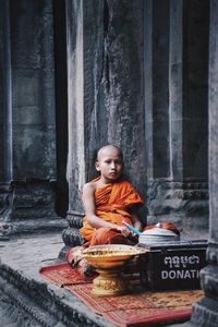 Young woman sitting outdoors