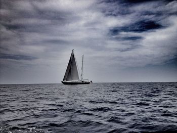 Sailboat sailing in sea