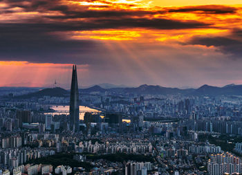 High angle view of city buildings during sunset