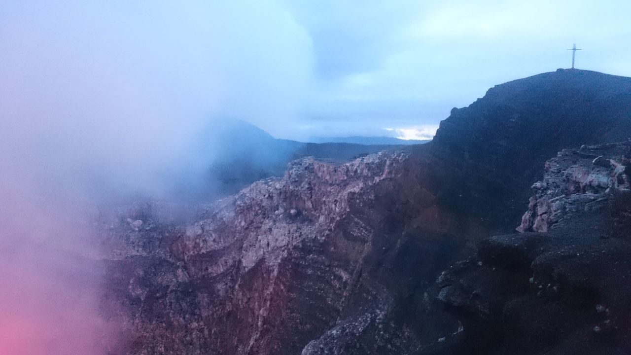 mountain, mountain range, scenics, tranquil scene, beauty in nature, tranquility, sky, fog, nature, weather, landscape, cloud - sky, idyllic, non-urban scene, foggy, physical geography, rocky mountains, day, majestic, outdoors