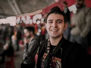 Portrait of young man standing outdoors