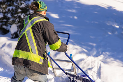 Rear view of man on snow