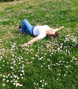 Girl standing on grassy field