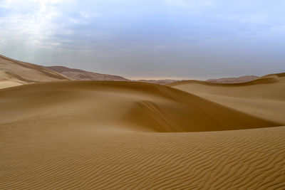 Scenic view of desert against sky