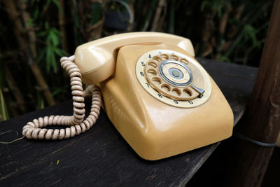 Close-up of telephone on table