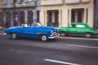 Car parked on street in front of road