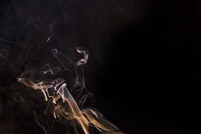 Close-up of smoke against black background