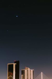 Low angle view of building against sky at night