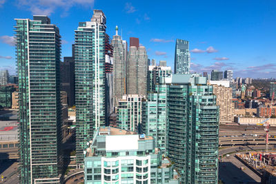 Modern buildings in city against sky