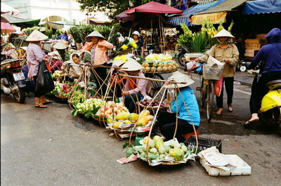 Group of people for sale at market stall