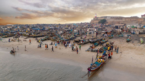 High angle view of people at beach against sky