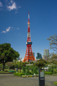 Tower in city against sky