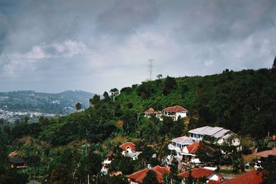 Residential district against cloudy sky