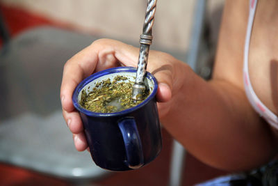 Close-up of woman hand holding drink