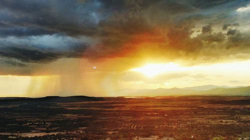 Scenic view of landscape against sky during sunset