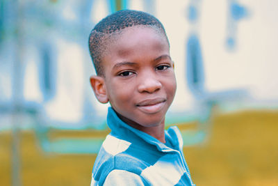 Close-up portrait of smiling cute boy