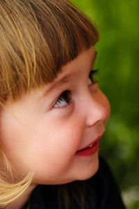Close-up portrait of cute girl looking away