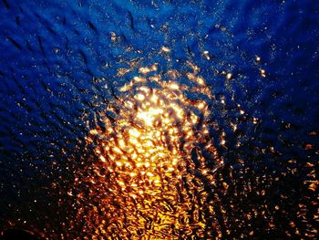 Full frame shot of illuminated water at night