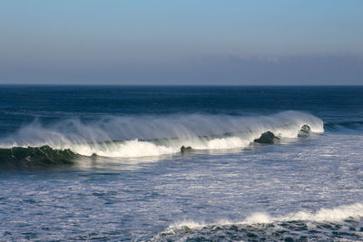 Scenic view of sea against clear sky