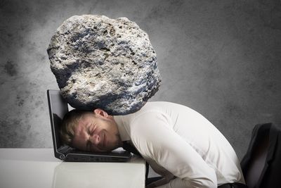 Man sleeping on rock