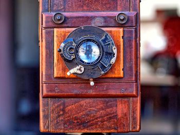 Close-up of telephone booth on wood