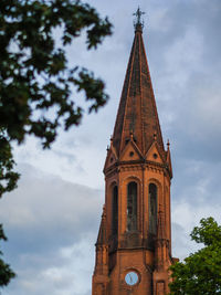 Low angle view of clock tower against sky