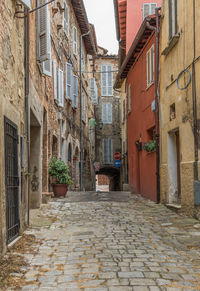 Narrow alley amidst buildings in town