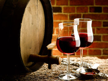 Close-up of wine glasses on table