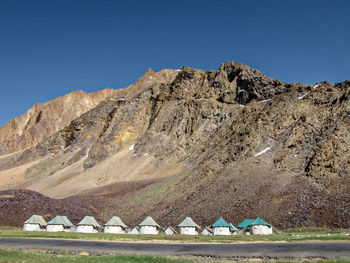 Scenic view of mountains against clear blue sky