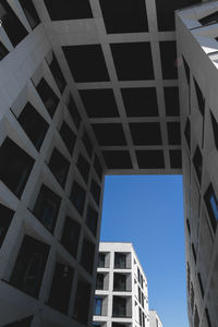 Low angle view of building against clear blue sky