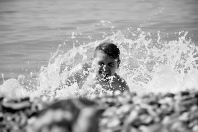 Boy swimming in water