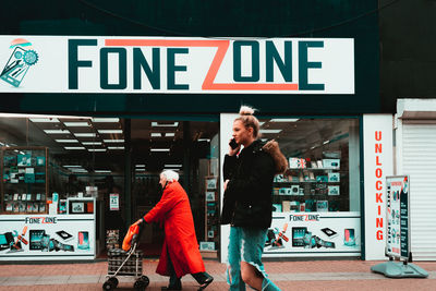 Friends standing on store