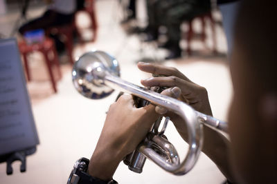 Close-up of man playing trumpet