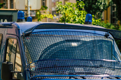 Close-up of a car against blue sky