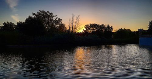 Scenic view of lake against sky during sunset